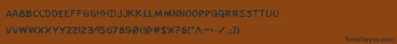 フォントFlesheatingbold – 黒い文字が茶色の背景にあります