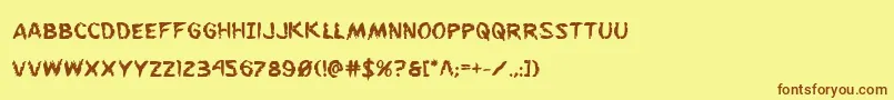 フォントFlesheatingbold – 茶色の文字が黄色の背景にあります。