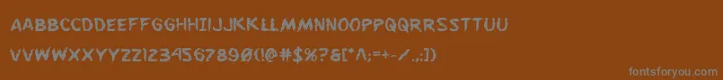 フォントFlesheatingbold – 茶色の背景に灰色の文字