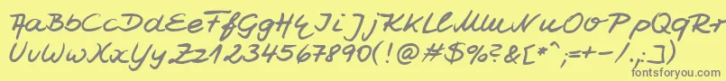 フォントHwJesco7Db – 黄色の背景に灰色の文字