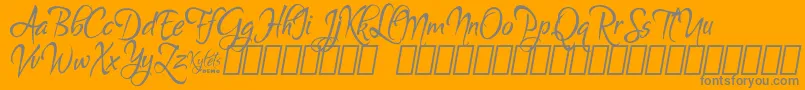 Fonte KyletsDemo – fontes cinzas em um fundo laranja