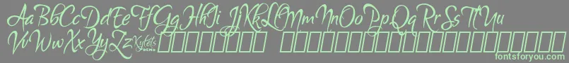 フォントKyletsDemo – 灰色の背景に緑のフォント