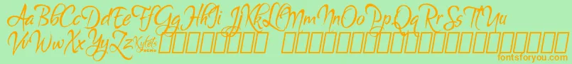 Шрифт KyletsDemo – оранжевые шрифты на зелёном фоне
