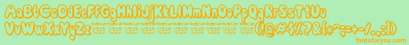 ComicWhiteRabbit-Schriftart – Orangefarbene Schriften auf grünem Hintergrund