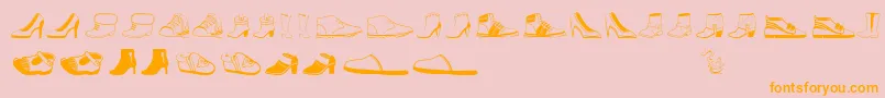Czcionka Womenandshoes – pomarańczowe czcionki na różowym tle