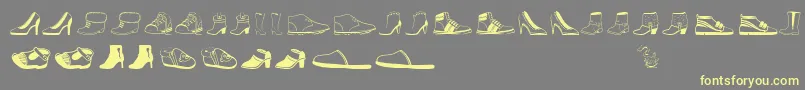 Womenandshoes-Schriftart – Gelbe Schriften auf grauem Hintergrund