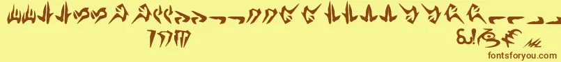 フォントNalHuttese – 茶色の文字が黄色の背景にあります。