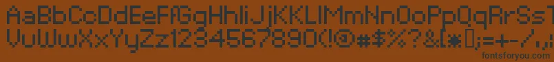 XpaiderPixelExplosion02 Font – Black Fonts on Brown Background