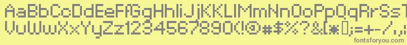 フォントXpaiderPixelExplosion02 – 黄色の背景に灰色の文字