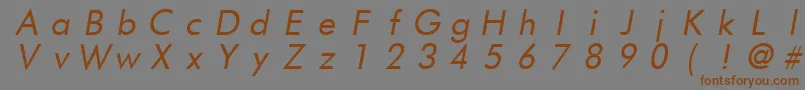 フォントFuturistfixedwidthItalic – 茶色の文字が灰色の背景にあります。