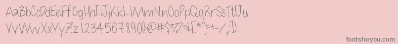 Cuteness-fontti – harmaat kirjasimet vaaleanpunaisella taustalla