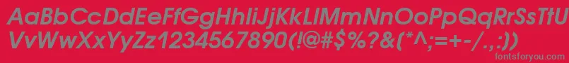 AvantgardegothicattBolditalic-fontti – harmaat kirjasimet punaisella taustalla