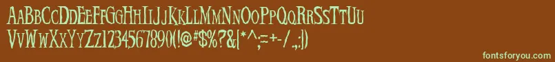 フォントDemonNi – 緑色の文字が茶色の背景にあります。