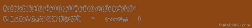 フォントThelogovals – 茶色の背景に灰色の文字