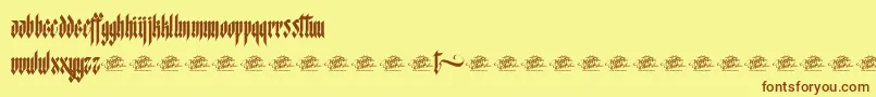 McfStarworms Font – Brown Fonts on Yellow Background
