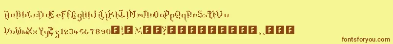 フォントTheTerrifficKerganogggg – 茶色の文字が黄色の背景にあります。