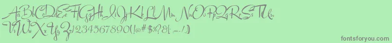 Lucyscript-Schriftart – Graue Schriften auf grünem Hintergrund