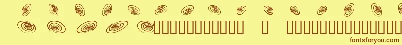 フォントOmegaswirls – 茶色の文字が黄色の背景にあります。