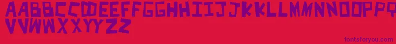CutItOut Font – Purple Fonts on Red Background