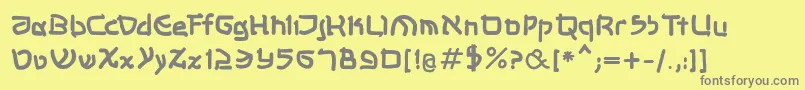 Shalommkbold-fontti – harmaat kirjasimet keltaisella taustalla