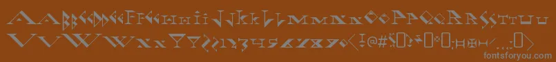 FadgodRegular-fontti – harmaat kirjasimet ruskealla taustalla
