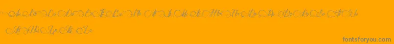 DianeDeFrance-Schriftart – Graue Schriften auf orangefarbenem Hintergrund