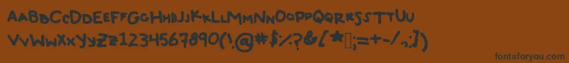 フォントTyeDyeJerky – 黒い文字が茶色の背景にあります