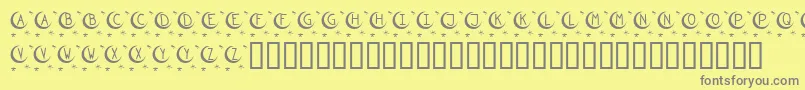 Fonte KrTwinkle – fontes cinzas em um fundo amarelo