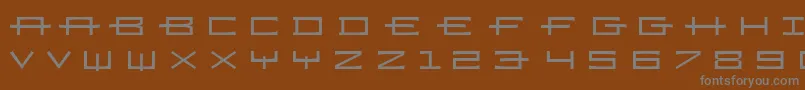 Ramizregulara-fontti – harmaat kirjasimet ruskealla taustalla