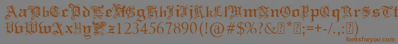 フォントPaulsSwirlyGothicFont – 茶色の文字が灰色の背景にあります。