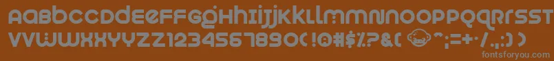 Czcionka Munkeyshine – szare czcionki na brązowym tle