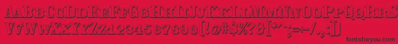 Traktoretkaoutline Font – Black Fonts on Red Background