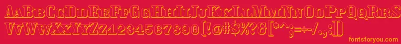フォントTraktoretkaoutline – 赤い背景にオレンジの文字