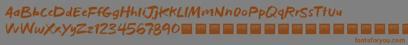 Шрифт BadHabitsDemo – коричневые шрифты на сером фоне