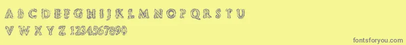 フォントStuccoRegular – 黄色の背景に灰色の文字