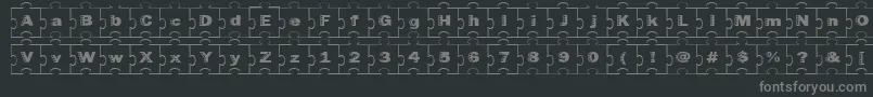 Fonte Failedfont2jigsaw – fontes cinzas em um fundo preto