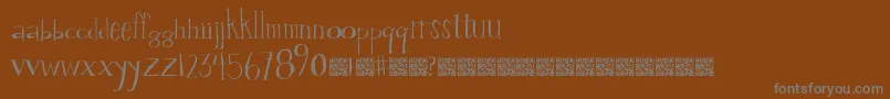 Valuestamp-Schriftart – Graue Schriften auf braunem Hintergrund