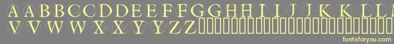 Czcionka Circleinitialsfree – żółte czcionki na szarym tle