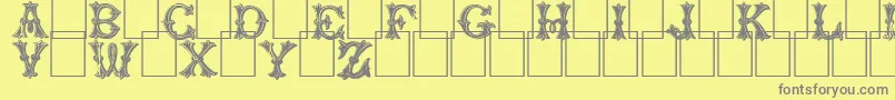 Trefoilcapitals Font – Gray Fonts on Yellow Background