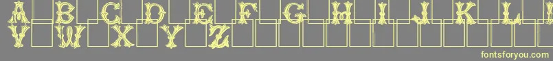 Trefoilcapitals Font – Yellow Fonts on Gray Background