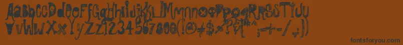 Czcionka RockShowWhiplash – czarne czcionki na brązowym tle