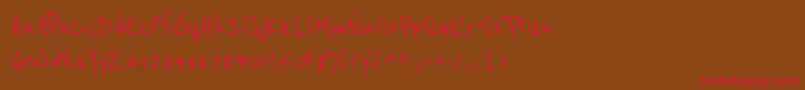 フォントReeniebeanie – 赤い文字が茶色の背景にあります。