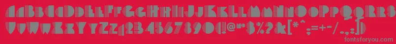 Backstage-fontti – harmaat kirjasimet punaisella taustalla