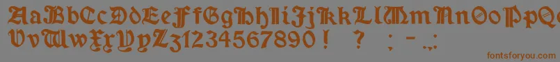 MinimExtrabold-Schriftart – Braune Schriften auf grauem Hintergrund