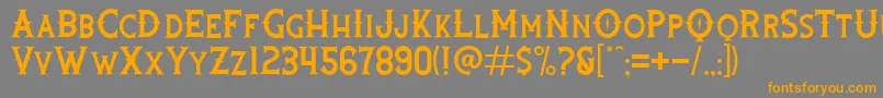 フォントRooters – オレンジの文字は灰色の背景にあります。
