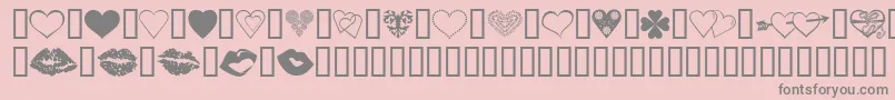 LuvNKisses-fontti – harmaat kirjasimet vaaleanpunaisella taustalla
