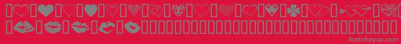 LuvNKisses-fontti – harmaat kirjasimet punaisella taustalla