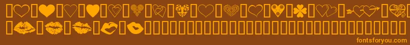 フォントLuvNKisses – オレンジ色の文字が茶色の背景にあります。