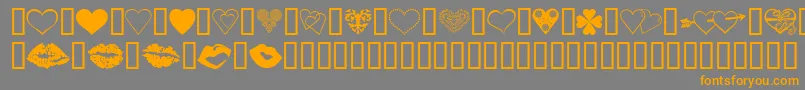 フォントLuvNKisses – オレンジの文字は灰色の背景にあります。