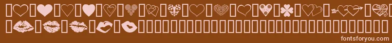 LuvNKisses-fontti – vaaleanpunaiset fontit ruskealla taustalla